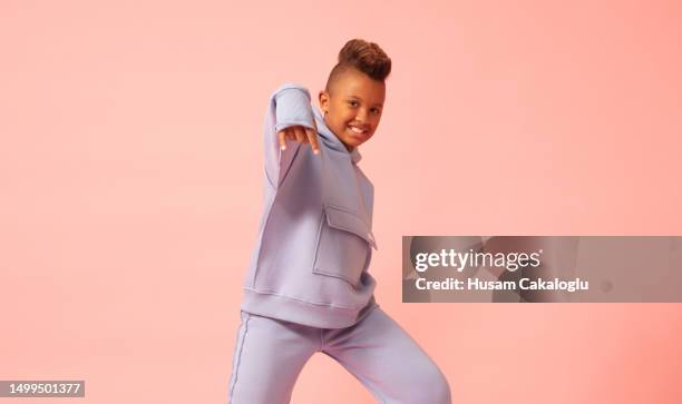 little boy posing as a rapper with a punk haircut. - rapper isolated stock pictures, royalty-free photos & images