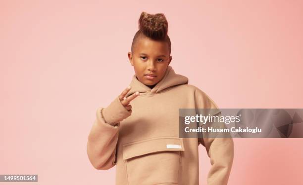 little boy posing as a rapper with a punk haircut. - rapper isolated stock pictures, royalty-free photos & images