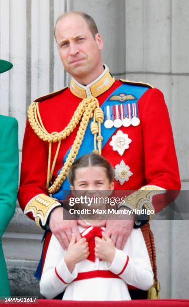 Prince William, Prince of Wales and Princess Charlotte of Wales watch an RAF flypast from the balcony of Buckingham Palace during Trooping the Colour...