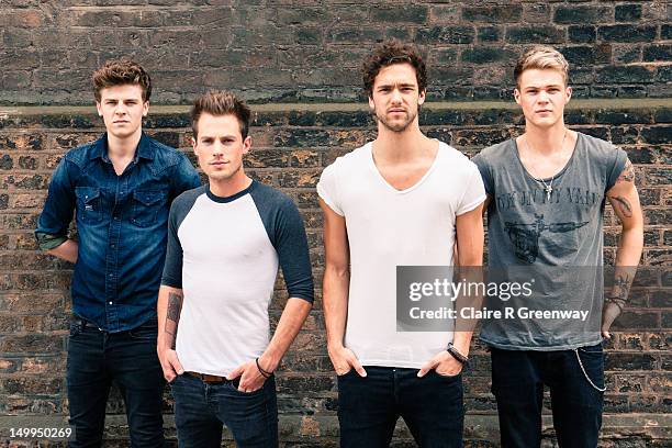 Lawson band members Joel Peat, Adam Pitts, Andy Brown and Ryan Fletcher pose during a Biz Session in Wapping on May 30, 2012 in London, England.