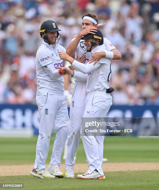 England bowler Stuart Broad celebrates with Ben Stokes and catcher Ollie Pope after the pair combined to dismiss Australia batsman Scott Boland...