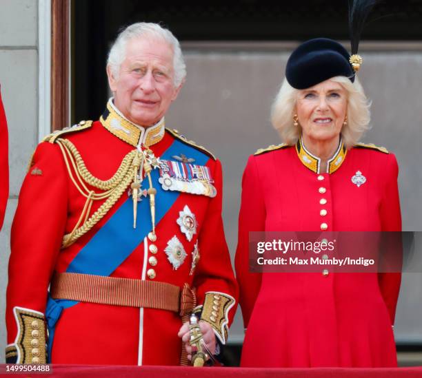 King Charles III and Queen Camilla watch an RAF flypast from the balcony of Buckingham Palace during Trooping the Colour on June 17, 2023 in London,...