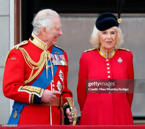 King Charles III and Queen Camilla watch an RAF flypast from the balcony of Buckingham Palace during Trooping the Colour on June 17, 2023 in London,...