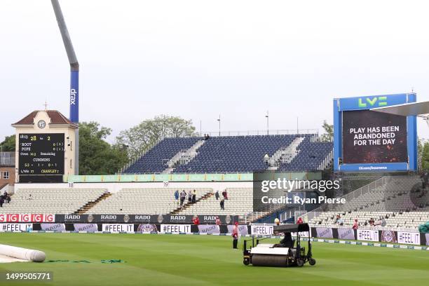 The electronic scoreboard shows play has been abandoned for the day during Day Three of the LV= Insurance Ashes 1st Test match between England and...