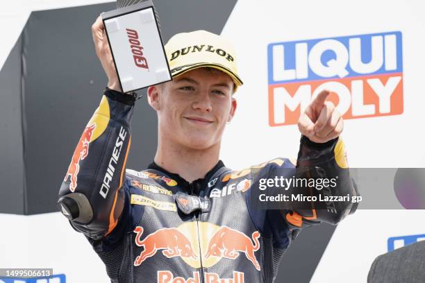 Daniel Holgado of Spain and Red Bull KTM Tech3 celebrates the thrid place on the podium during the Moto3 race during the MotoGP of Germany - Race at...