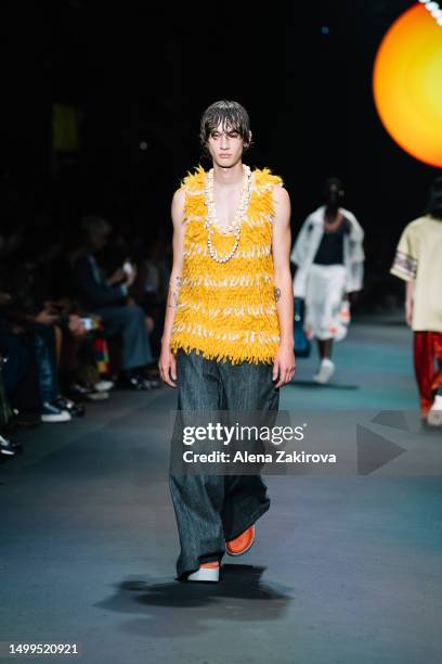 Model walks the runway at the Etro Spring/Summer 2024 fashion show during the Milan Fashion Week menswear spring/summer 2024 on June 18, 2023 in...