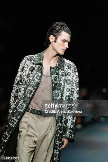 Model walks the runway at the Etro Spring/Summer 2024 fashion show during the Milan Fashion Week menswear spring/summer 2024 on June 18, 2023 in...