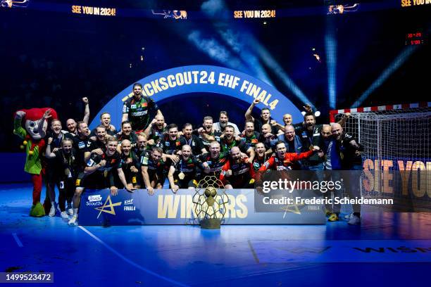 Players of Magdeburg celebrate the victory after reiceiving the trophy after the EHF FINAL4 Men Champions League final match between SC Magdeburg v...