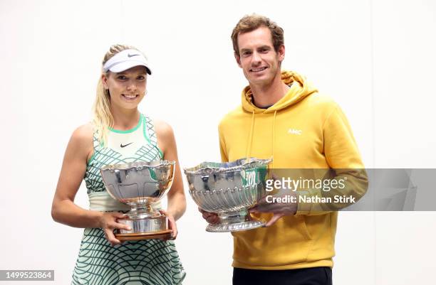 Katie Boulter of Great Britain and Andy Murray of Great Britain hold the Women's and Mens Singles Rothesay Open Trophy after the Rothesay Open at...