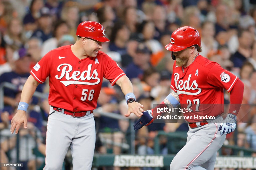 Jfire Reds Table Jake Fraley of the Cincinnati Reds high fives J.R. House after... News ...