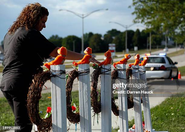 Mourners visit a make shift memorial near the Sikh Temple of Wisconsin August 2012 Oak Creek Wisconsin. A suspected gunman, 40-year-old Wade Michael...