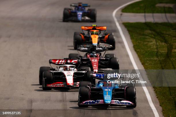 Esteban Ocon of France driving the Alpine F1 A523 Renault leads Kevin Magnussen of Denmark driving the Haas F1 VF-23 Ferrari on track during the F1...