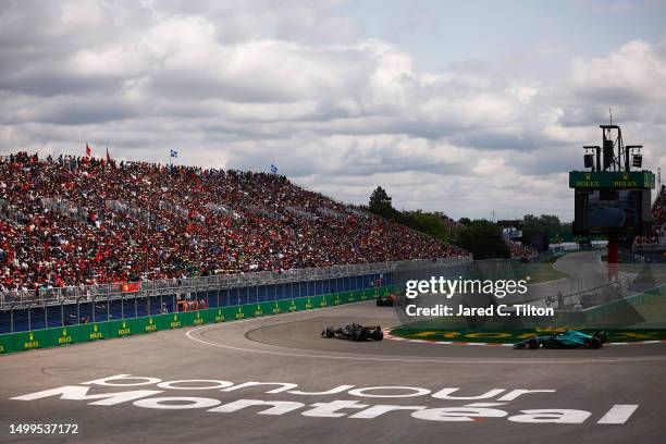 Max Verstappen of the Netherlands driving the Oracle Red Bull Racing RB19 leads Lewis Hamilton of Great Britain driving the Mercedes AMG Petronas F1...