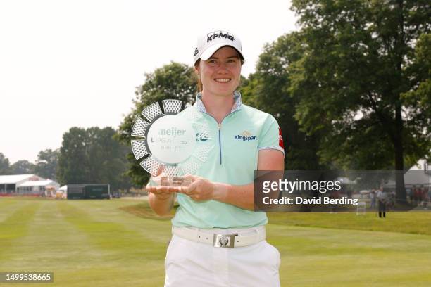 Leona Maguire of Ireland poses for a photo with the trophy after winning the Meijer LPGA Classic for Simply Give at Blythefield Country Club on June...