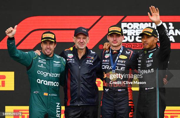 Second placed Fernando Alonso of Spain and Aston Martin F1 Team, Adrian Newey, the Chief Technical Officer of Red Bull Racing, First placed Max...