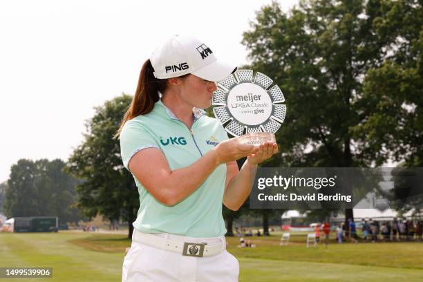 Leona Maguire of Ireland poses for a photo with the trophy after winning the Meijer LPGA Classic for Simply Give at Blythefield Country Club on June...