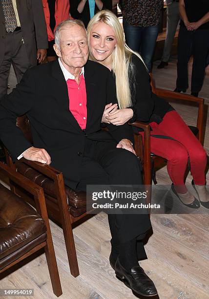 Playboy Founder Hugh Hefner and Playmate Crystal Harris attend The Beverly Hills City Council and Playboy Enterprises, Inc. Ribbon cutting ceremony...