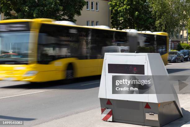 speed camera with a fast bus - lasergun stockfoto's en -beelden