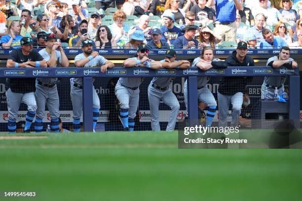 Members of the Pittsburgh Pirates watch action during the ninth inning against the Milwaukee Brewers at American Family Field on June 18, 2023 in...