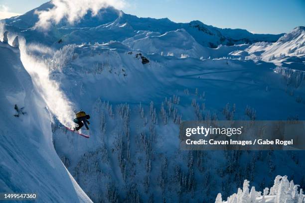 man skiing in backcountry at mt. baker, washington - skier jumping stock pictures, royalty-free photos & images