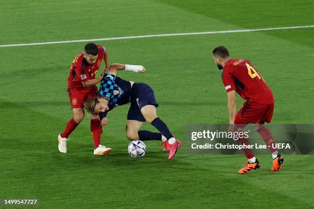 Lovro Majer of Croatia is challenged by Jordi Alba of Spain during the UEFA Nations League 2022/23 final match between Croatia and Spain at De Kuip...