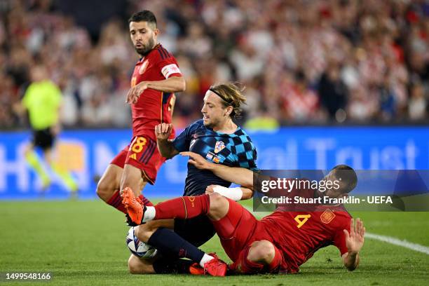 Lovro Majer of Croatia is challenged by Nacho of Spain during the UEFA Nations League 2022/23 final match between Croatia and Spain at De Kuip on...