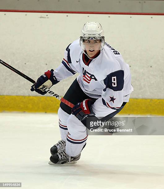 Cole Bardreau of the USA White Squad skates against Team Sweden at the USA hockey junior evaluation camp at the Lake Placid Olympic Center on August...