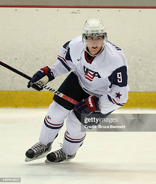 Cole Bardreau of the USA White Squad skates against Team Sweden at the USA hockey junior evaluation camp at the Lake Placid Olympic Center on August...