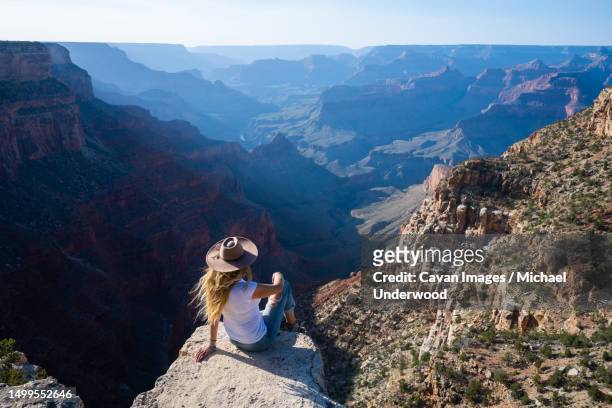 woman overlooking hazy grand canyon in arizona - x世代 ストックフォトと画像