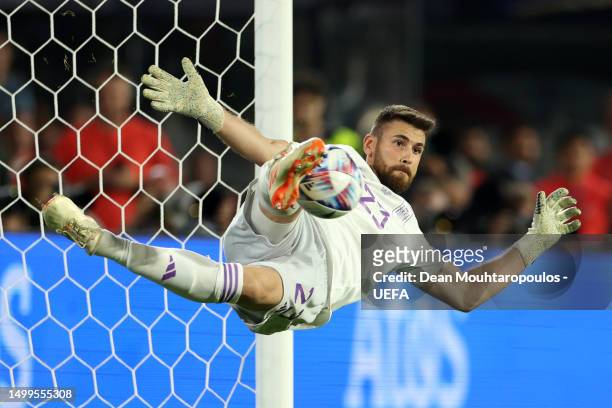 Unai Simon of Spain saves the fourth penalty from Lovro Majer of Croatia in the penalty shoot out during the UEFA Nations League 2022/23 final match...