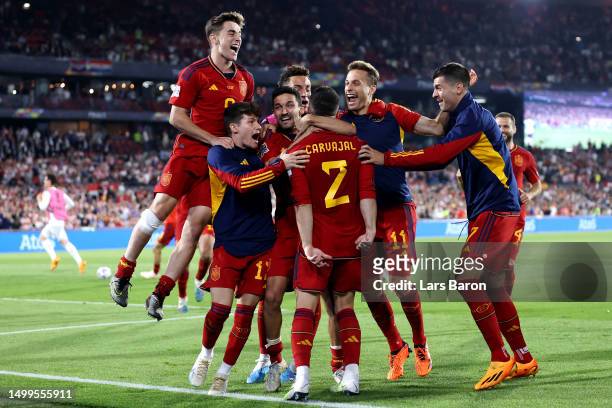 Dani Carvajal of Spain celebrates with teammates after scoring the winning penalty in the penalty shoot out during the UEFA Nations League 2022/23...