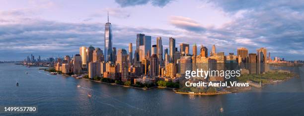 aerial panorama of lower manhattan at golden hour - world trade center manhatten stock pictures, royalty-free photos & images