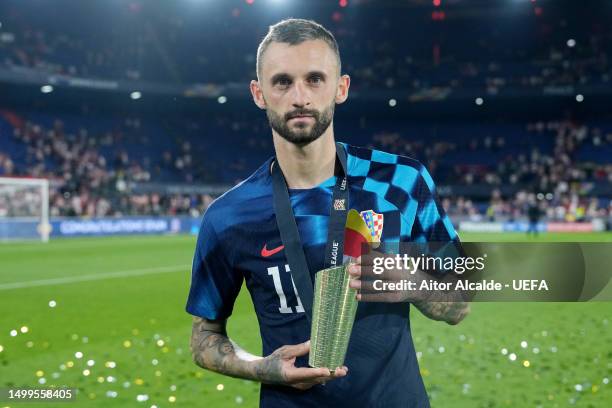 Marcelo Brozovic of Croatia poses for a photo after being awarded Player of the Match in the UEFA Nations League 2022/23 final match between Croatia...