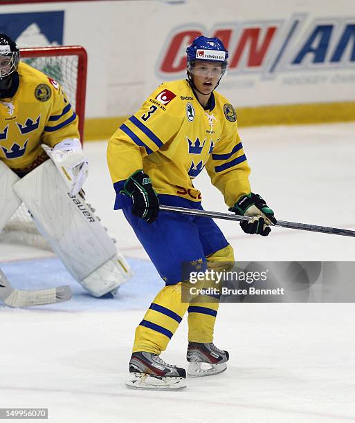 Hampus Lindholm of Team Sweden skates against Team Finland at the USA hockey junior evaluation camp at the Lake Placid Olympic Center on August 7,...