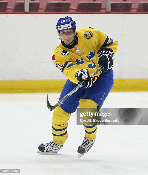 Max Gortz of Team Sweden skates against Team Finland at the USA hockey junior evaluation camp at the Lake Placid Olympic Center on August 7, 2012 in...