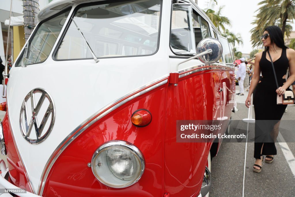 Yellow Vw Rodeo Attendee looks at a 1961 Volkswagen Transporter at the 2023 Rodeo ...