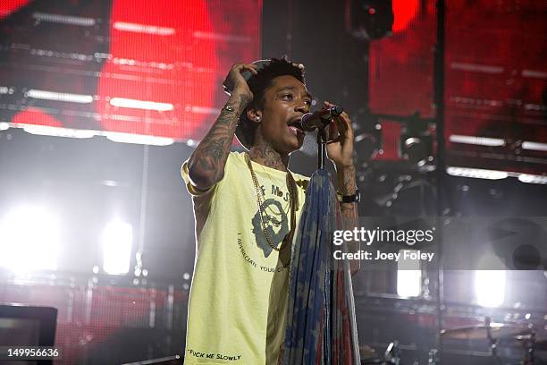 Wiz Khalifa performs onstage during the opening night of the 'Under the Influence Tour' at Riverbend Music Center on July 26, 2012 in Cincinnati,...