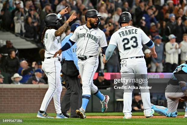 Crawford, Ty France, and Teoscar Hernandez score off of Jarred Kelenic of the Seattle Mariners three RBI triple during the eighth inning against the...