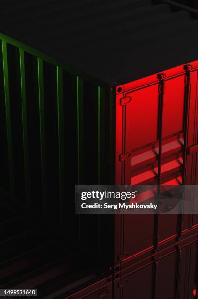 close-up of shipping container warehouse in red neon light at night. - shipping containers green red stock-fotos und bilder