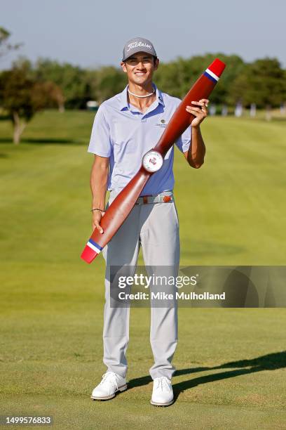 Ricky Castillo of the United States celebrates with the trophy after winning the Blue Cross and Blue Shield of Kansas Wichita Open at Crestview...