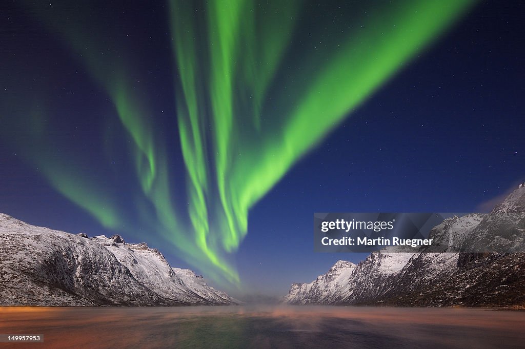 Northern lights (Aurora Borealis) at a fjord
