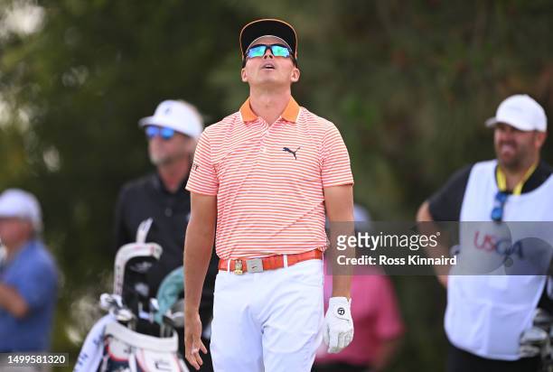 Rickie Fowler of the United States reacts to his tee shot on the 11th tee during the final round of the 123rd U.S. Open Championship at The Los...