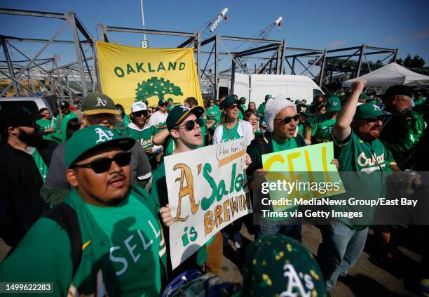 Oakland Athletics fans chant Sell the team as they take part in a Reverse Boycott event at the Coliseum in Oakland, Calif., on Tuesday, June 13,...