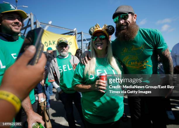 Oakland Athletics fan April Kenton, of Tracy, poses with former As pitcher Dallas Braden during the Reverse Boycott event at the Coliseum in Oakland,...