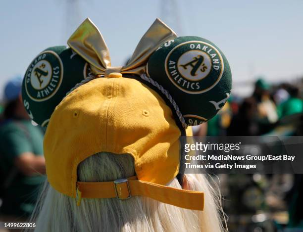 Oakland Athletics fan April Kenton, of Tracy, wears a festive hat during the Reverse Boycott event at the Coliseum in Oakland, Calif., on Tuesday,...