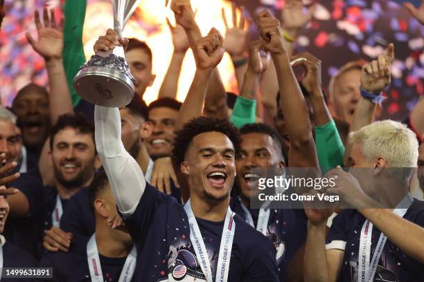 Antonee Robinson takes the trophy after winning the CONCACAF Nations League Championship Final between United States and Canada at Allegiant Stadium...