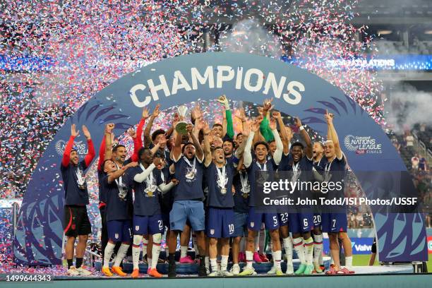 Weston McKennie of the United States holds the championship trophy while celebraing the United States Men's National Team victory over Canada after...