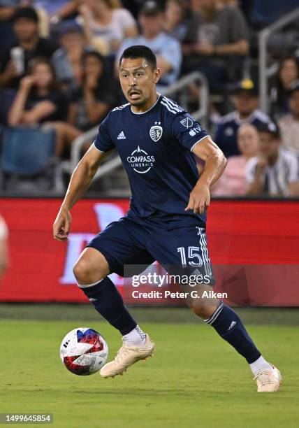 Roger Espinoza of Sporting Kansas City dribbles the ball up field against Los Angeles FC in the second half on June 17, 2023 at Children's Mercy Park...