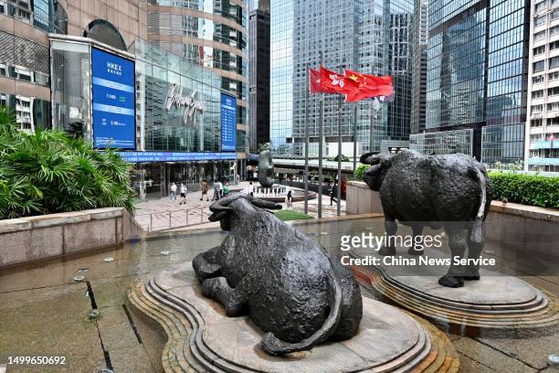 Bull statues are seen on the Exchange Square complex, which houses the Hong Kong Stock Exchange , on June 19, 2023 in Hong Kong, China. The HKD-RMB...