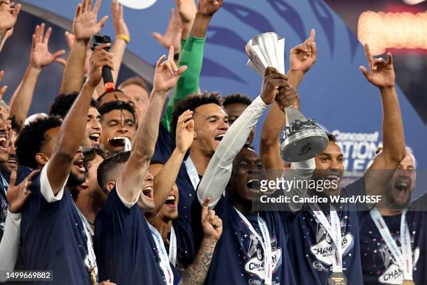Folarin Balogun of the United States holds the championship trophy after the 2023 CONCACAF Nations League Final against Canada at Allegiant Stadium...